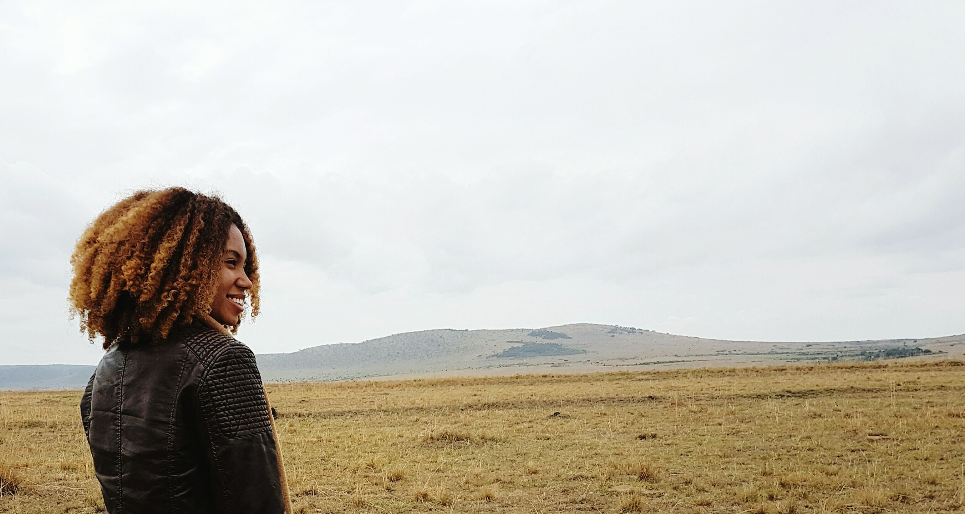 woman in front of mountain landscape