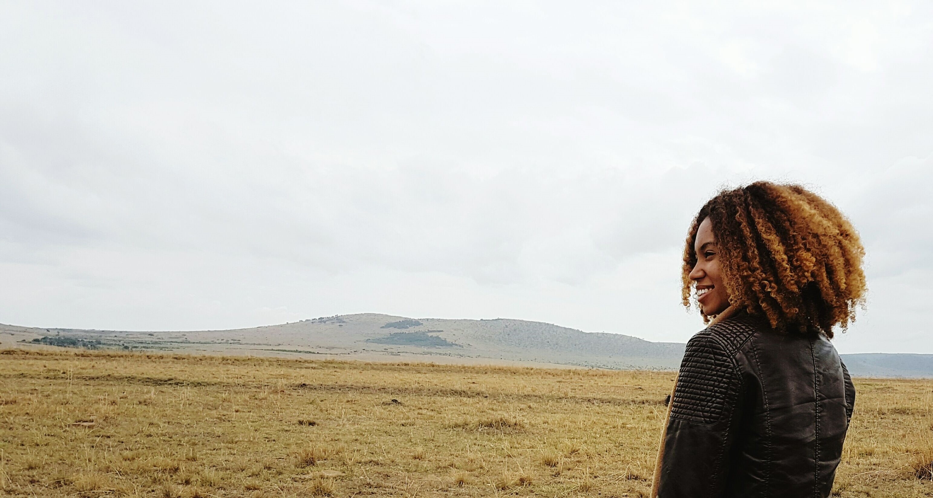 woman in front of mountain landscape